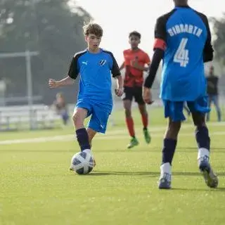 Soccer player in blue jersey at LaLiga Academy Dubai