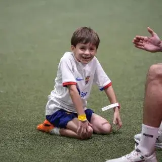 Summer Camp Uae |A happy young player enjoys his time at the football summer camp in Dubai