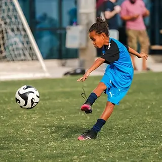 Boy Playing Kids Football Soccer Action Shot