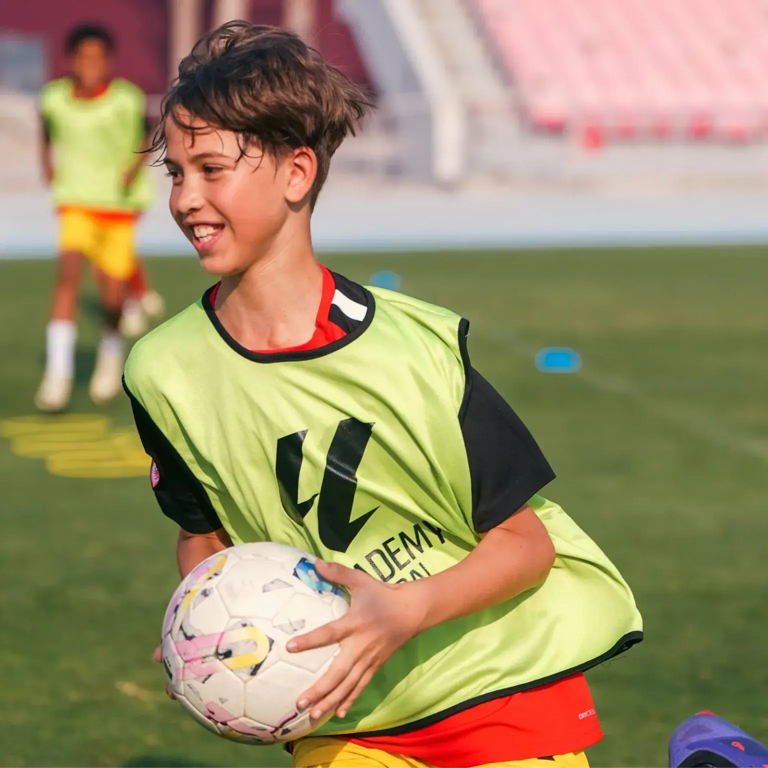 A young male with a footbal ball during a pre-IBER Cup training session.