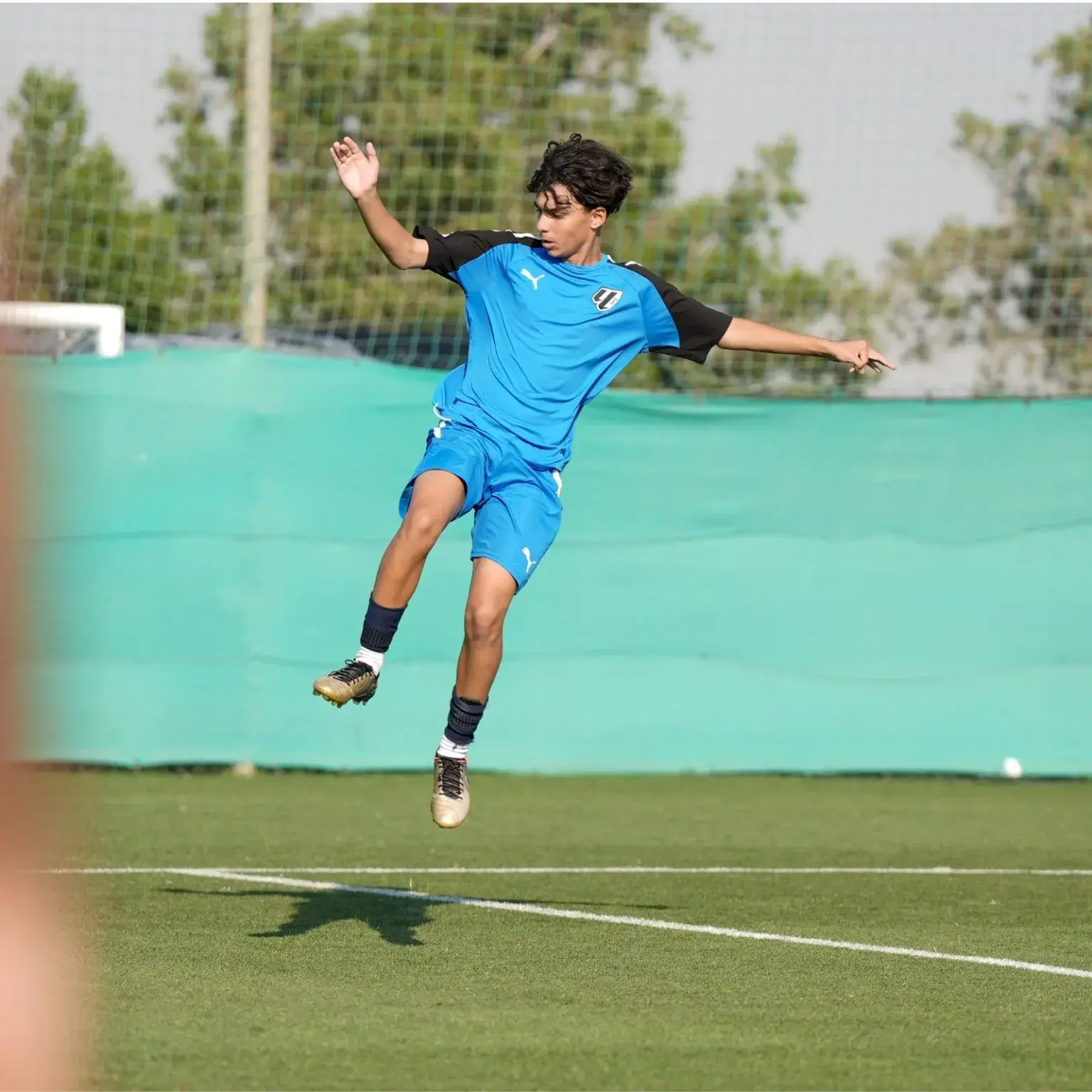 A young man jumping high in the air | Mina Cup 2024.