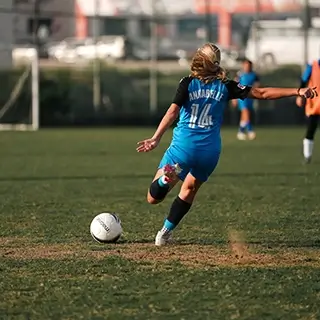 Young Woman Practicing Soccer: Kicking the Ball | Girls Football