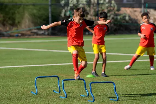 Children Playing Soccer During Football Coaching in Dubai