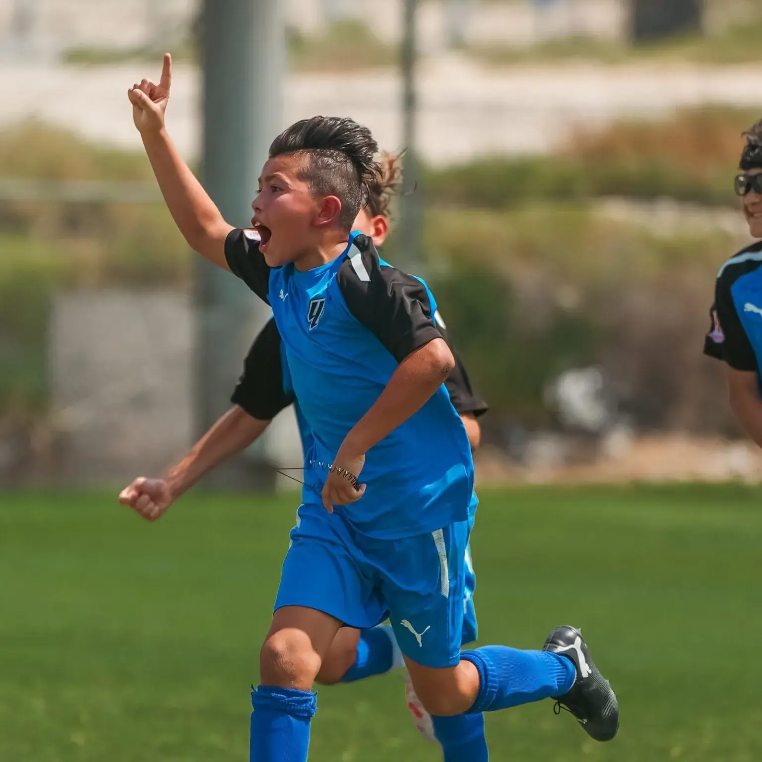 Players wearing a blue shirt, smiling brightly at DOFA Season 2023.