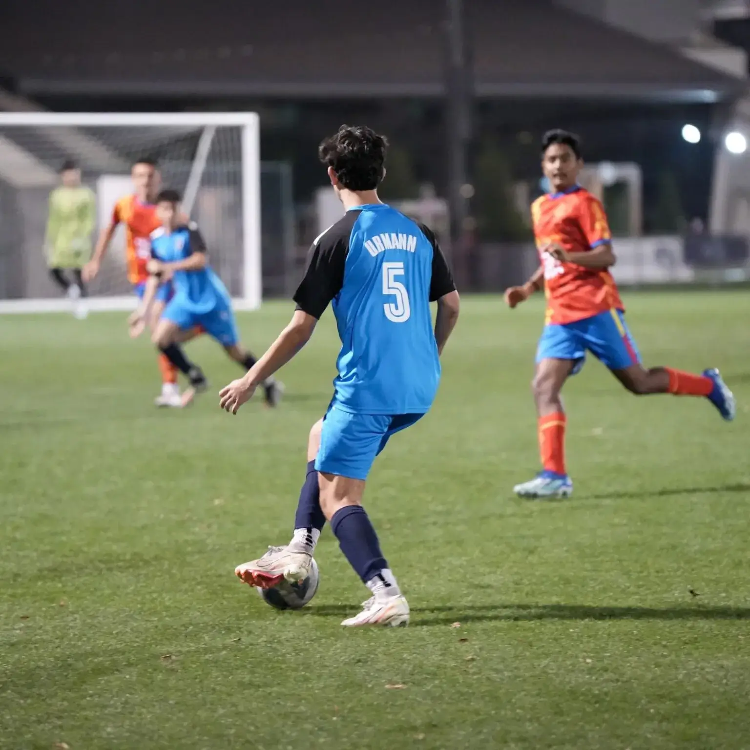 DOFA Season 2023 | Soccer player in blue and orange jersey kicking ball