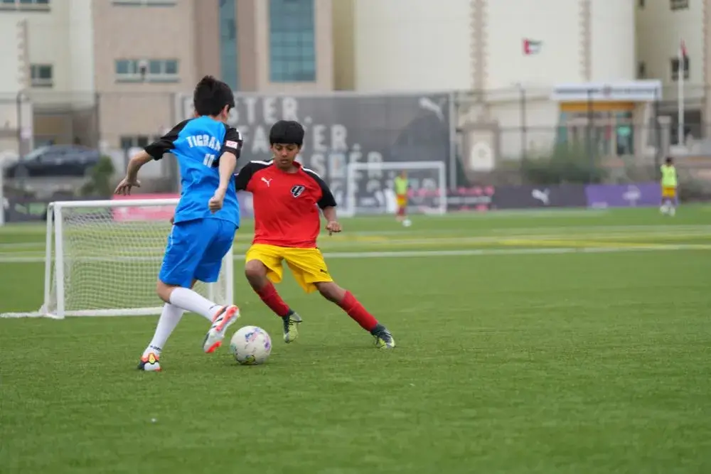 Two Boys Playing Football on Field | Football Training for Beginners Near Me