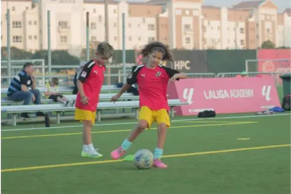 Football training for beginners near me| Two children are playing football to learn football skills on Development Program