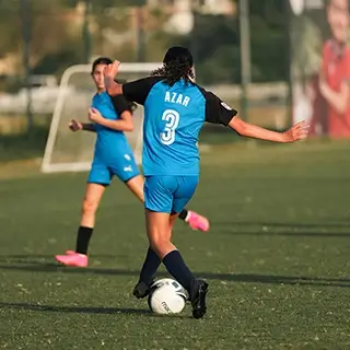 Girls Football | Kicking the Ball on the Field